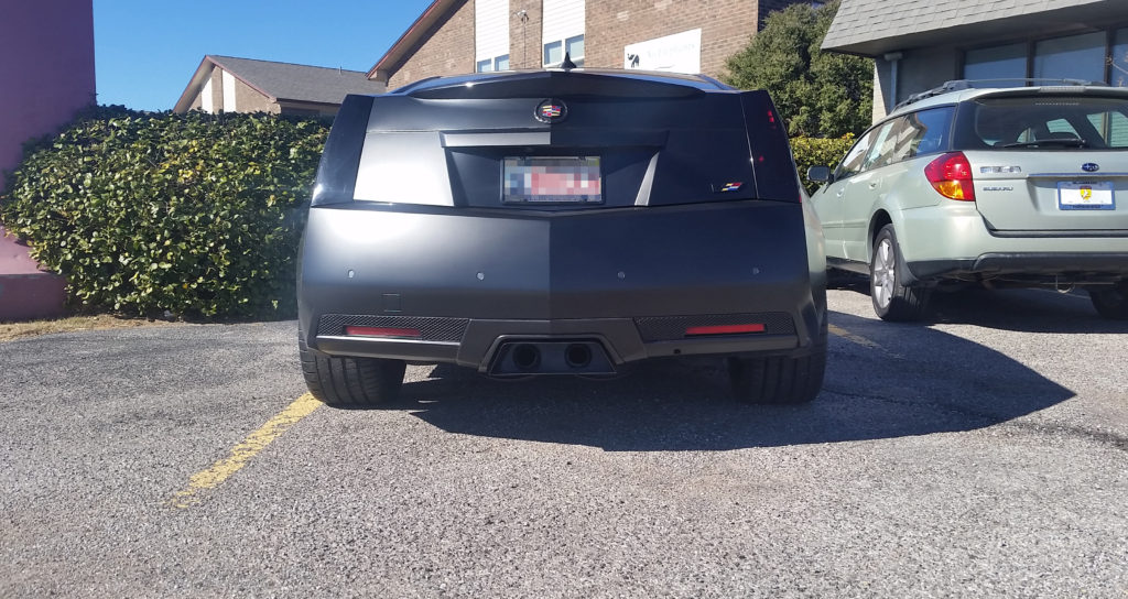 This customer brought their late model, Cadillac CTS-V in after having a custom exhaust tip made and power-coated. We had to modify the tip - cutting holes for the exhaust pipes - to install it, but we made certain we got it mounted as perfectly as was possible.