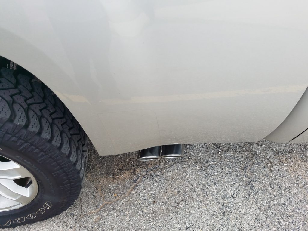 2013 Chevy Silverado that the customer requested true dual exhaust with both tailpipes and tips exiting out of the passenger side of the truck, in front of the rear tire. We call these "shotgun" tailpipes.